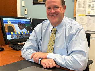 Principal ORourke at his desk