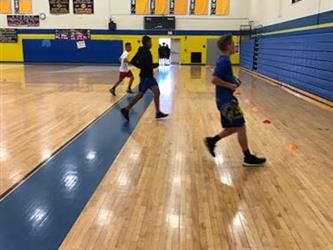 Students running in the gym