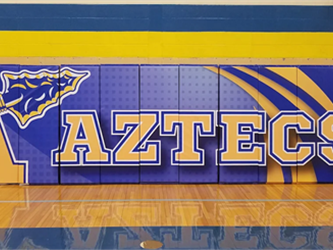 gym wall with aztec logo