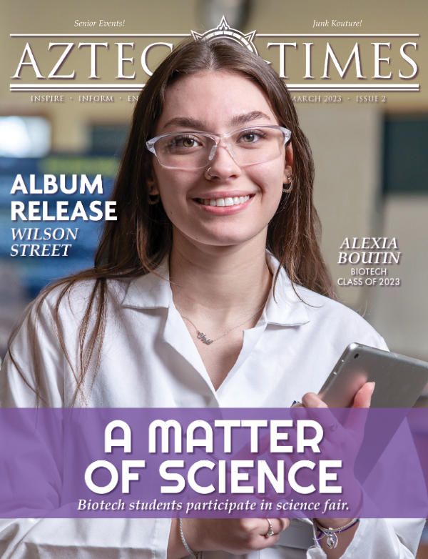 a magazine cover featuring a woman in a white lab coat, and article headlines all around her